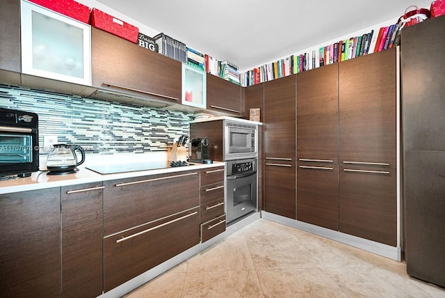 kitchen with dark brown cabinets, decorative backsplash, stainless steel appliances, and light tile patterned floors