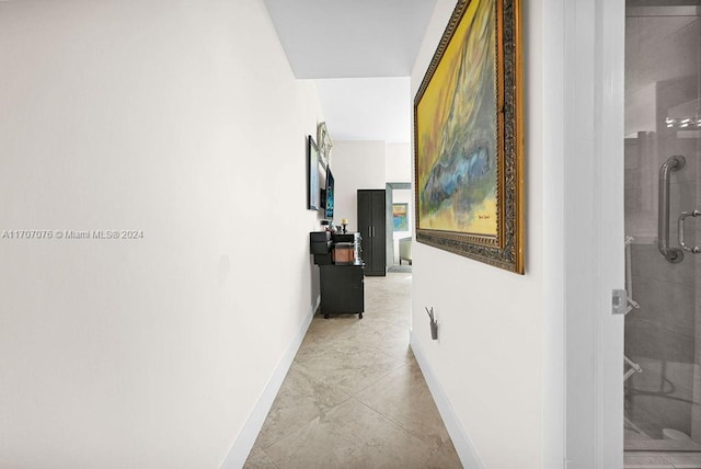 hall with light tile patterned flooring