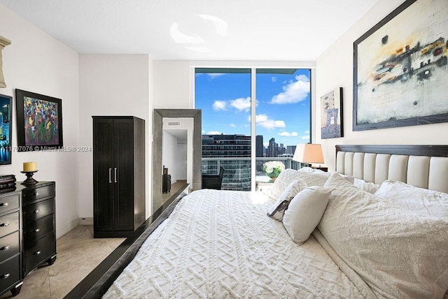 bedroom with floor to ceiling windows