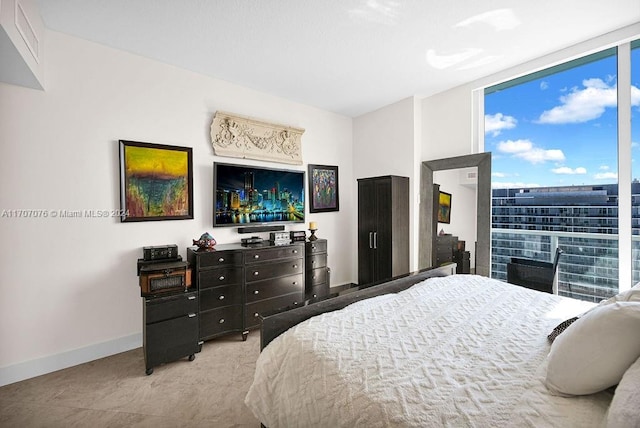 bedroom with floor to ceiling windows