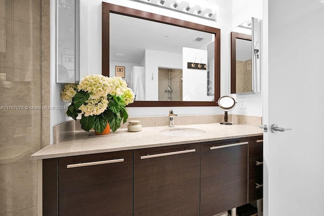 bathroom with vanity and walk in shower