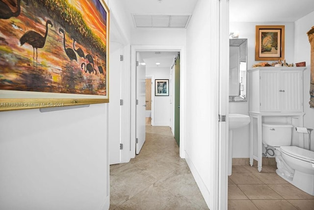 hallway featuring light tile patterned flooring