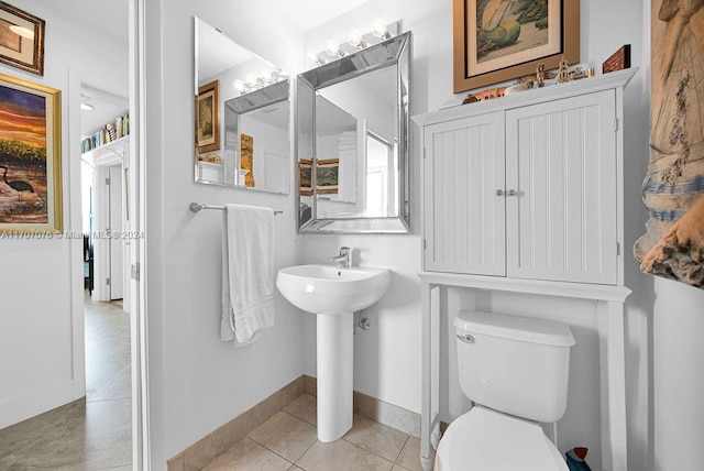 bathroom with tile patterned flooring and toilet