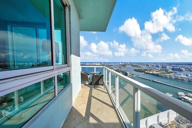 balcony featuring a water view