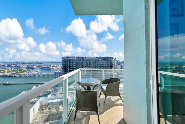 balcony featuring a water view