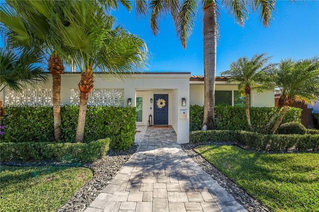 mediterranean / spanish house featuring a front lawn