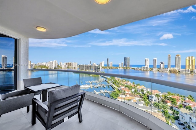 balcony featuring a water view