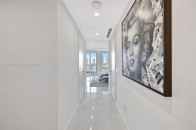 hallway with light tile patterned floors