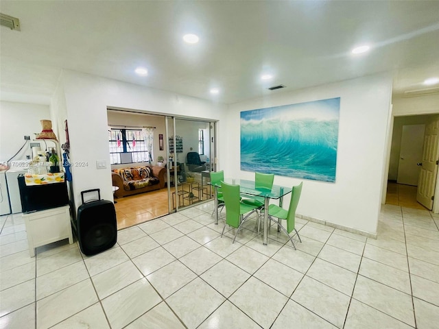 dining space with light tile patterned floors