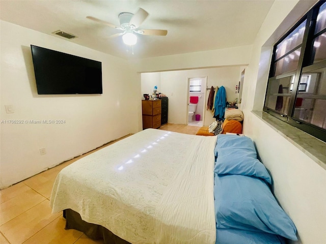 bedroom featuring light tile patterned floors and ceiling fan