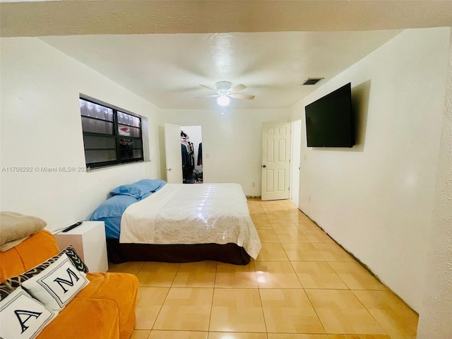 tiled bedroom with ceiling fan