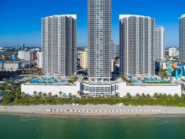 city view featuring a water view and a beach view