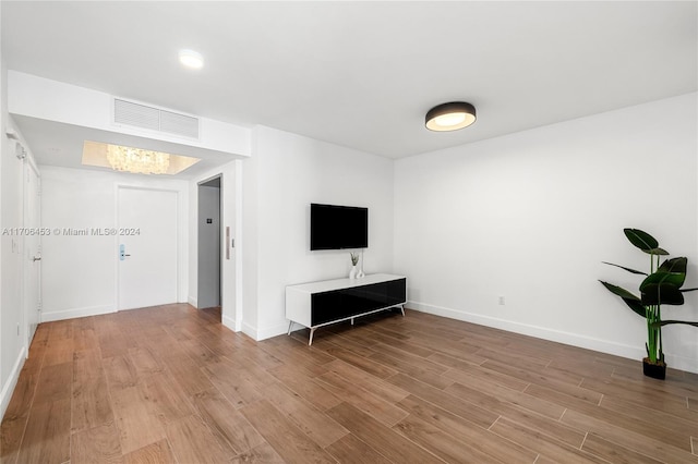 unfurnished living room with light hardwood / wood-style floors