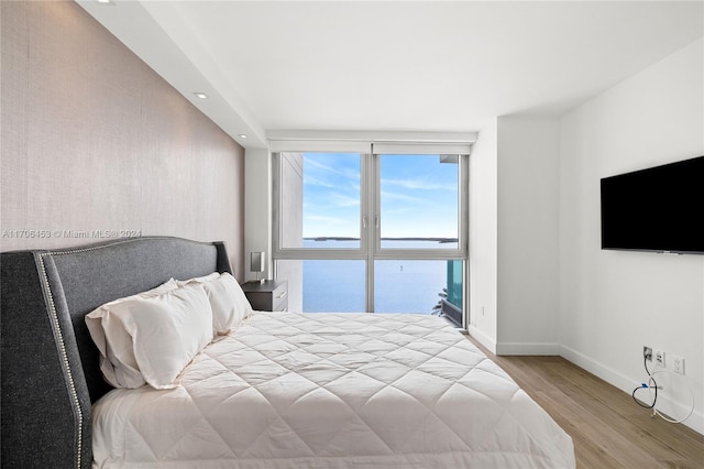 bedroom with light wood-type flooring