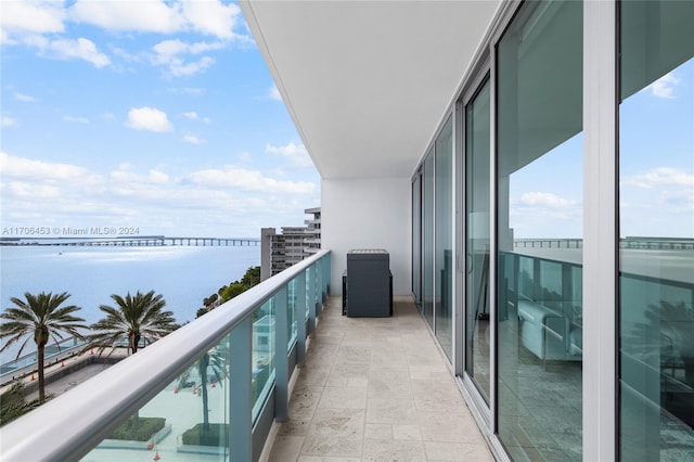 balcony featuring a water view