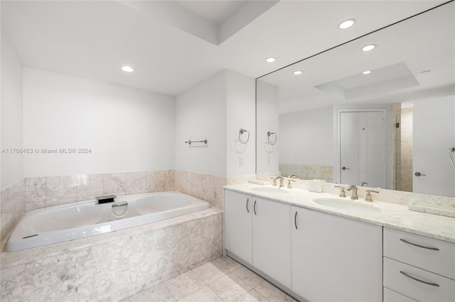 bathroom featuring plus walk in shower, tile patterned flooring, and vanity