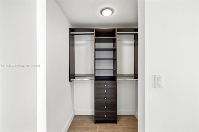 walk in closet featuring light hardwood / wood-style floors