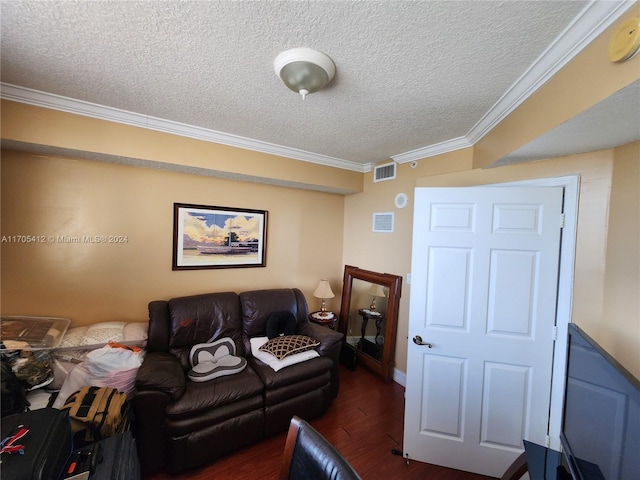 living room with a textured ceiling, dark hardwood / wood-style flooring, and ornamental molding