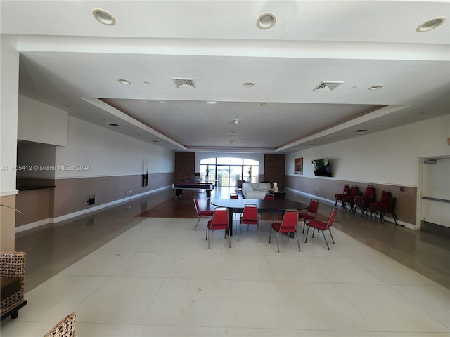 dining space with a tray ceiling