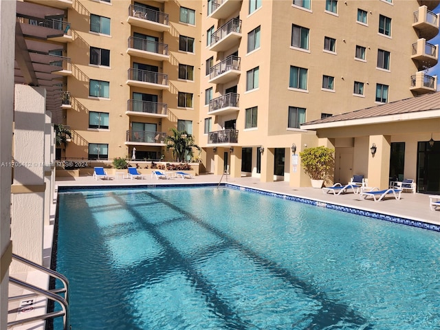 view of swimming pool featuring a patio area