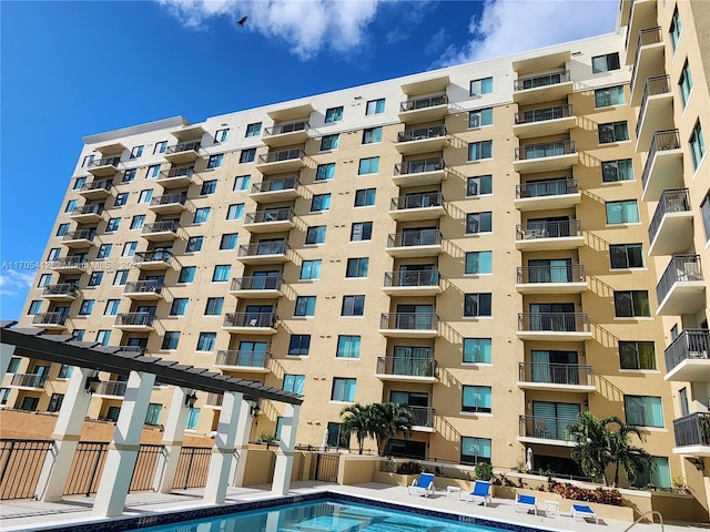 view of property with a community pool