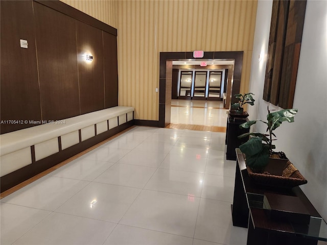 hallway with light tile patterned floors