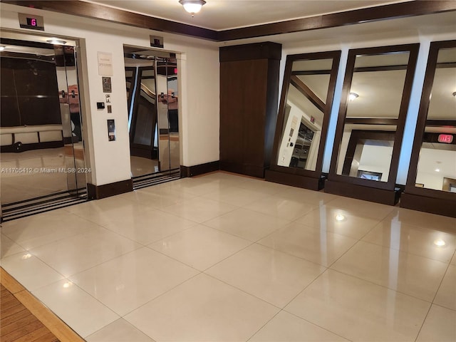 unfurnished room featuring light tile patterned floors