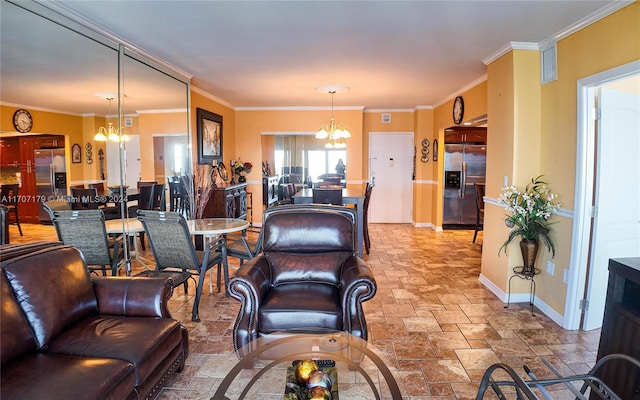 living room featuring ornamental molding and a notable chandelier