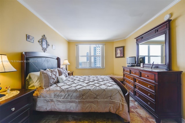 bedroom with multiple windows and crown molding