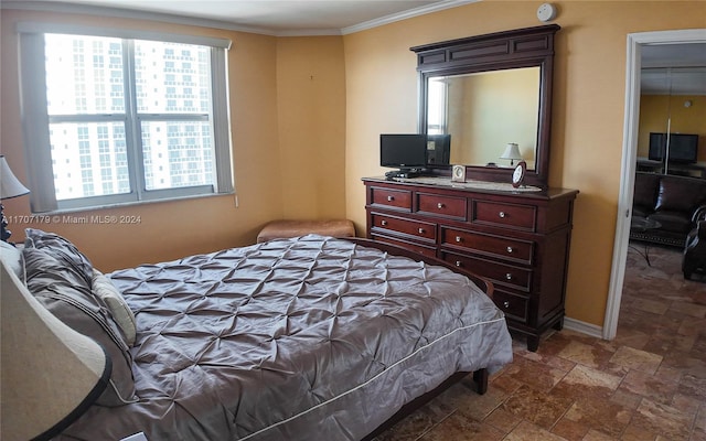 bedroom featuring crown molding