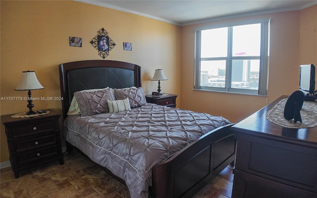 bedroom featuring crown molding