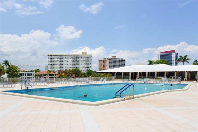 view of swimming pool with a patio area