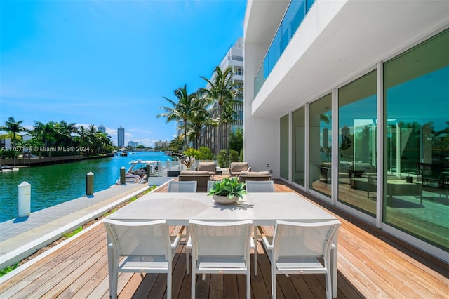 wooden deck featuring a water view