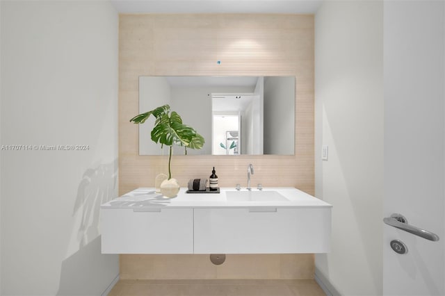 bathroom with tile patterned floors and vanity