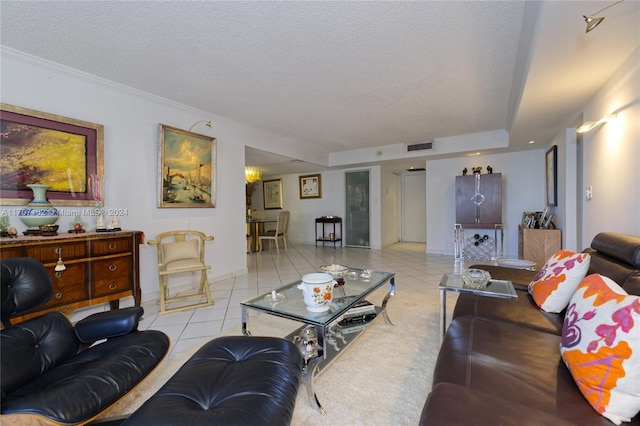 living room with light tile patterned floors and a textured ceiling