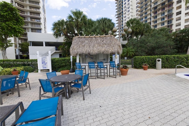 view of patio with an outdoor bar