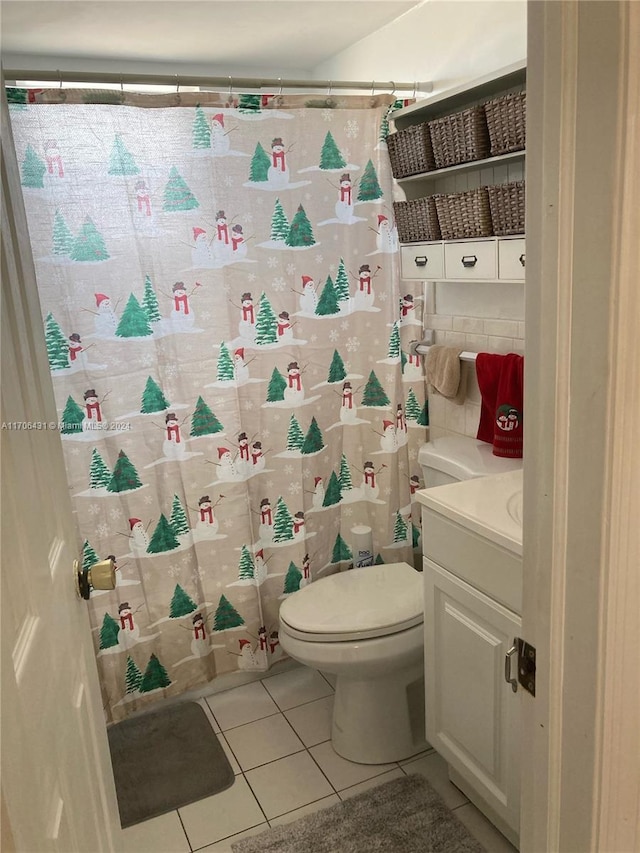 bathroom featuring tile patterned floors, vanity, a shower with shower curtain, and toilet