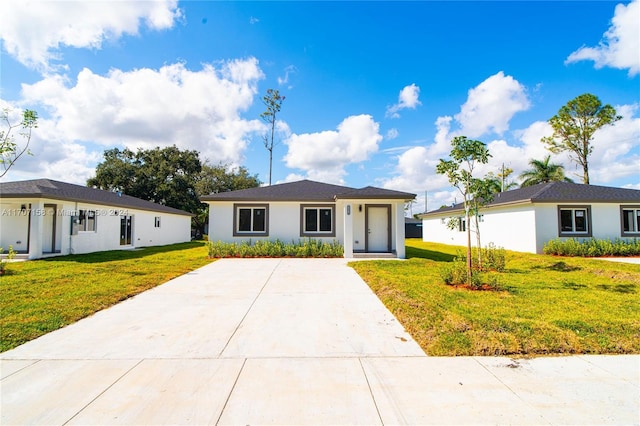 ranch-style house with a front lawn