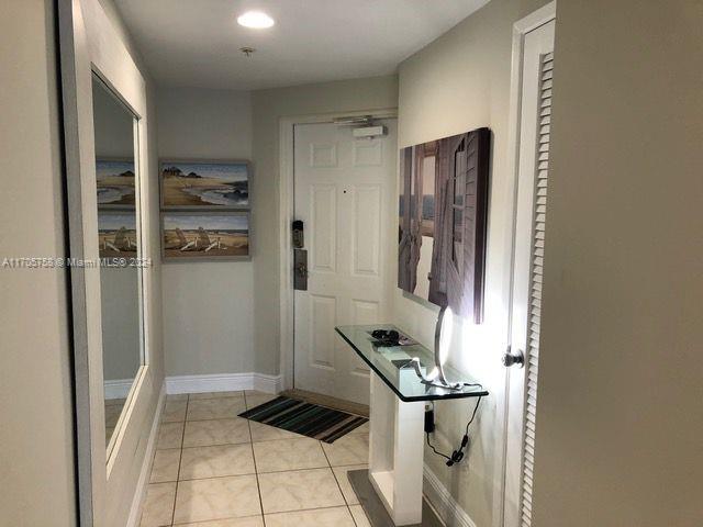 interior space with light tile patterned floors