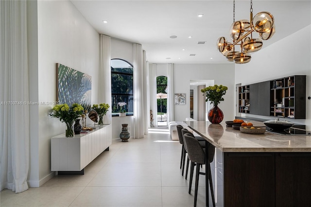 dining area featuring light tile patterned flooring