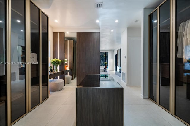 corridor with light tile patterned flooring