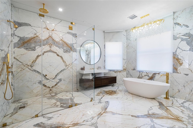 bathroom featuring vanity and shower with separate bathtub