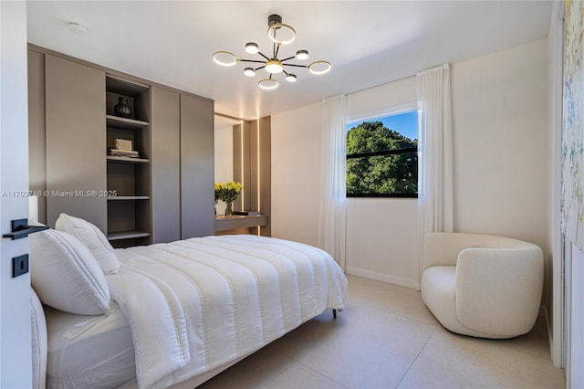 bedroom featuring an inviting chandelier