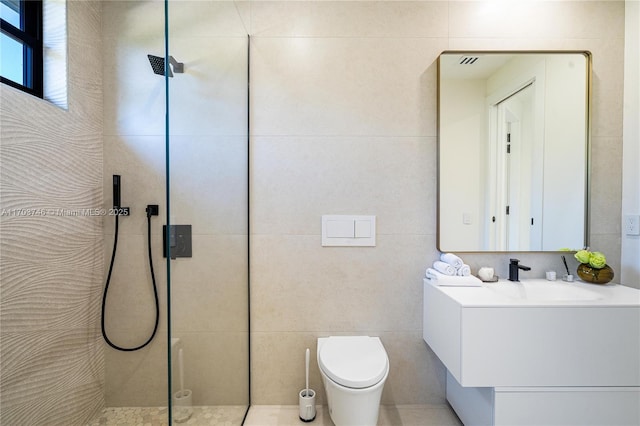 bathroom with a shower, tile walls, toilet, and vanity