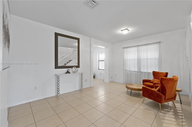 living area featuring light tile patterned floors