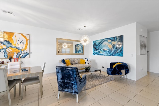 living room featuring a notable chandelier and light tile patterned flooring