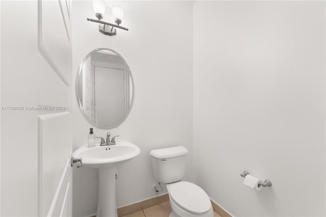 bathroom featuring tile patterned floors, sink, and toilet