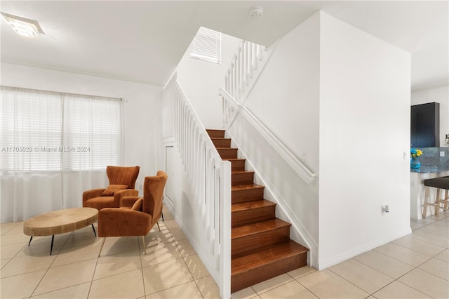 staircase with tile patterned flooring