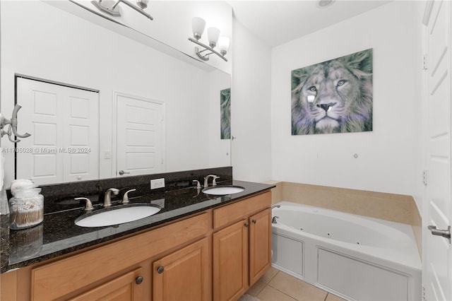 bathroom with tile patterned floors, vanity, and a bathtub