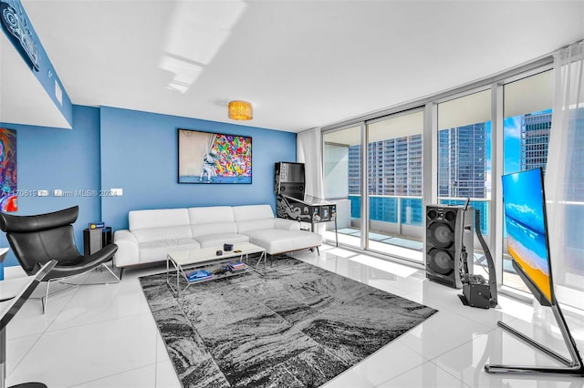 tiled living room with floor to ceiling windows